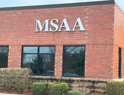 brick building with the letters 'MSAA' on it