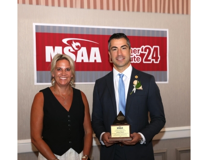 Andrew Rebello receiving award for MSAA High School Principal of the Year